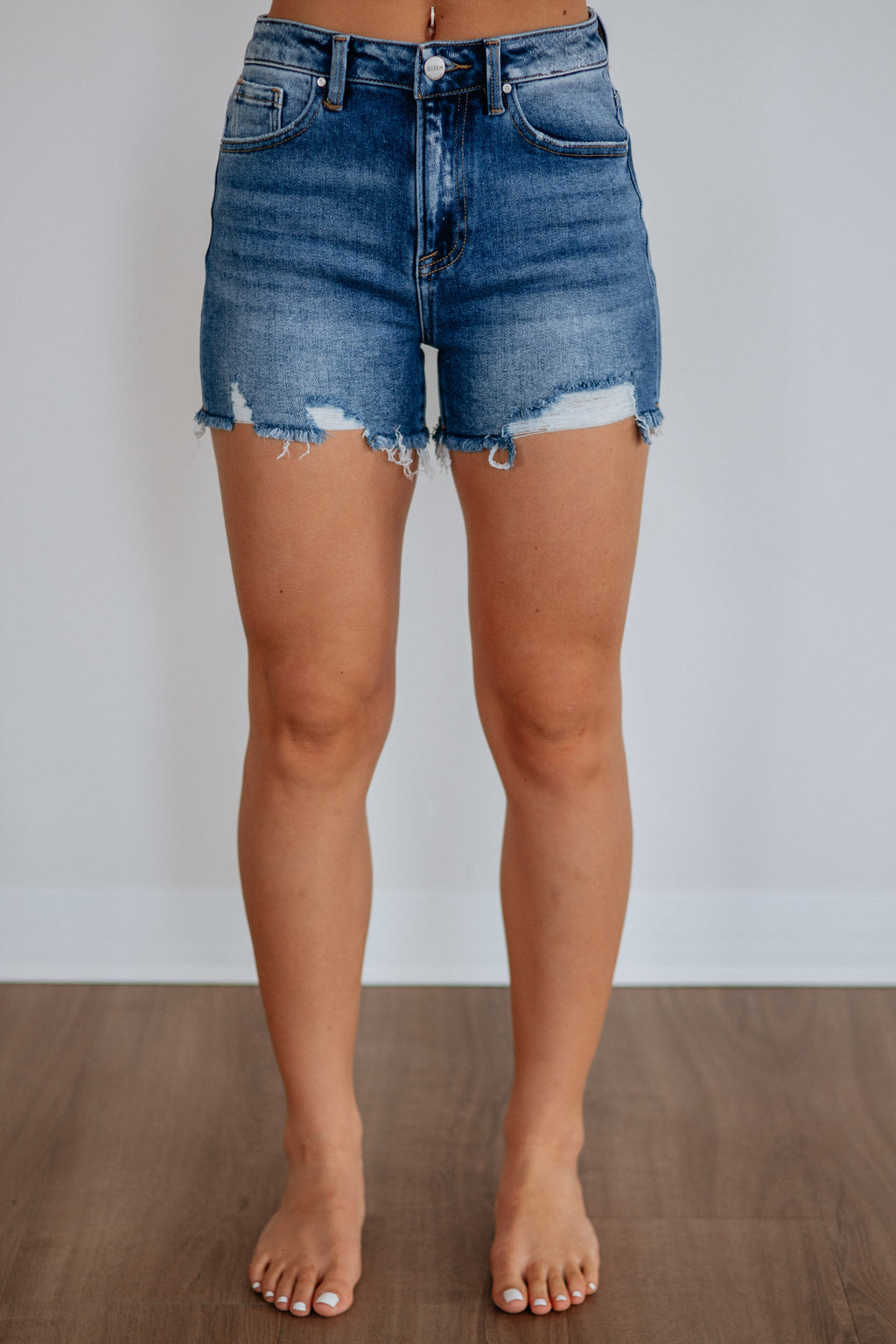 High Rise Distressed Raw Hem Denim Shorts in Dark Wash Cotton