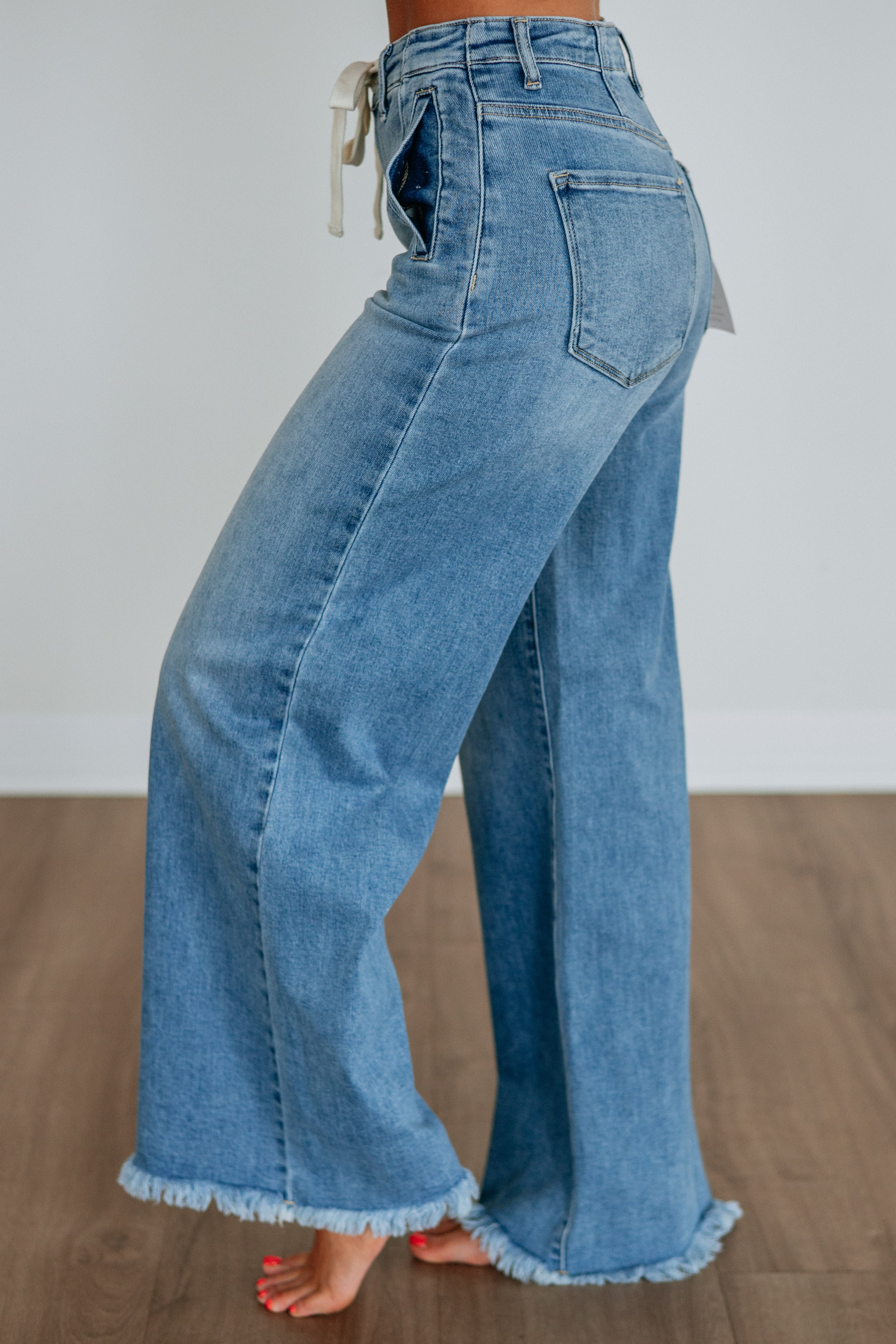 High Rise Wide Leg Drawstring Raw Hem Long Inseam Jeans in Medium Wash